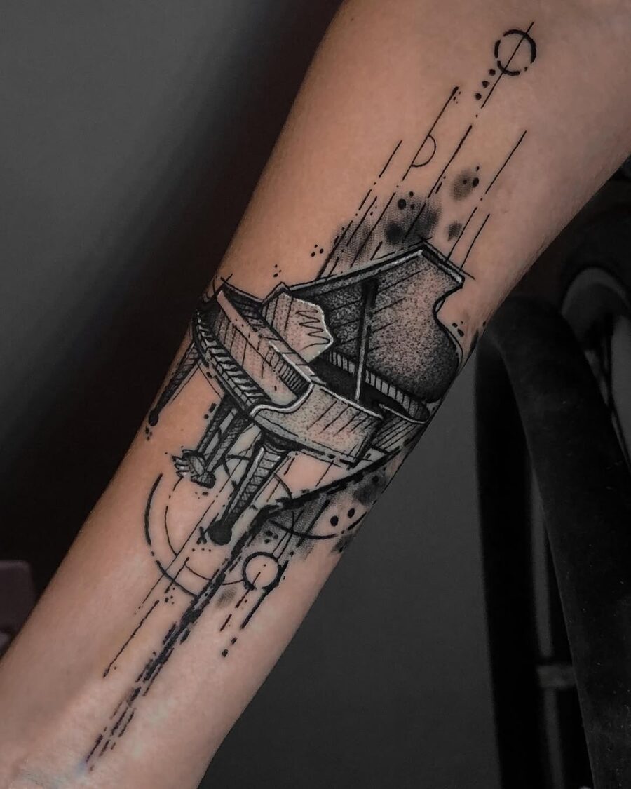 Elegant grand piano tattoo on the arm