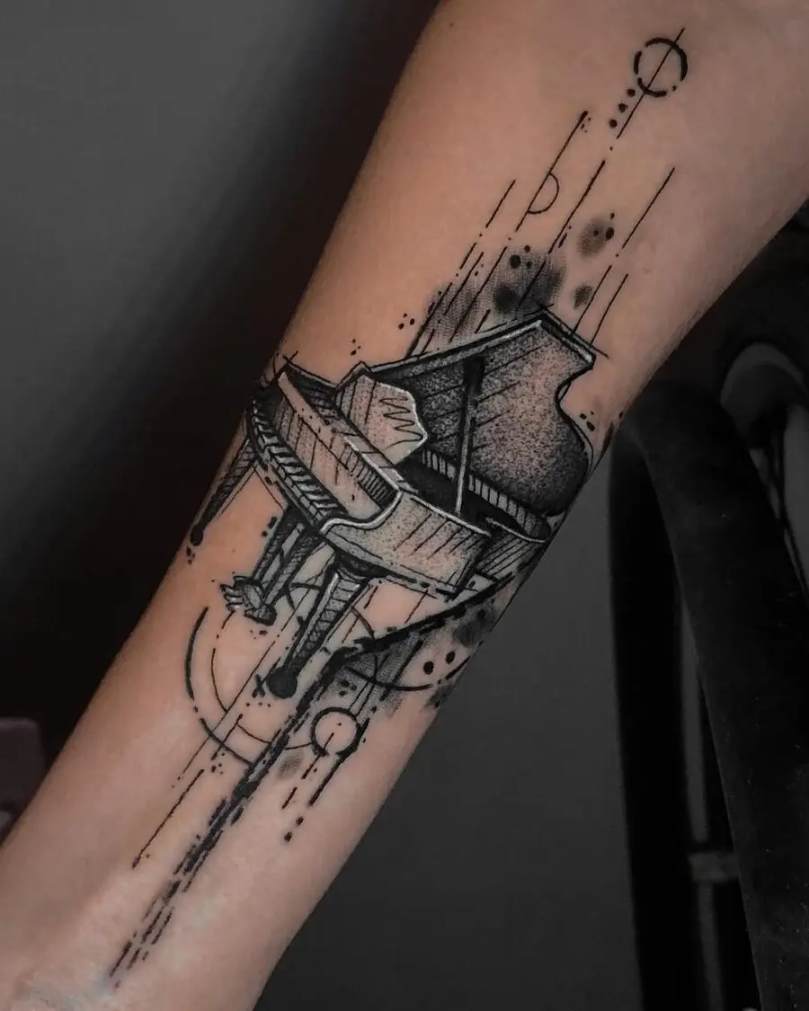 Elegant grand piano tattoo on the arm