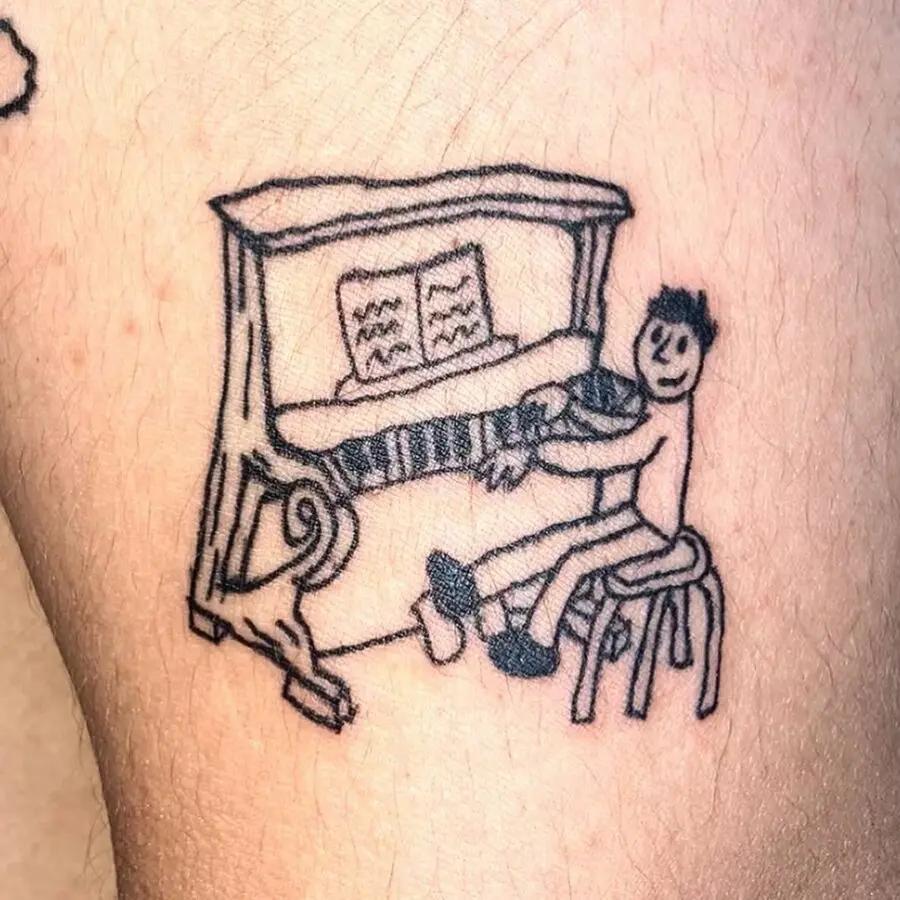 Joyful character playing piano tattoo design