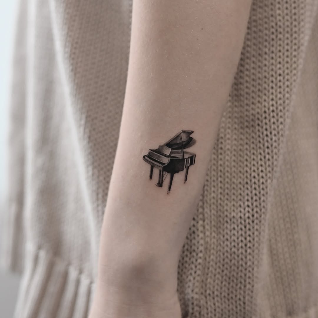 Stylish Minimalist Piano Tattoo on Forearm