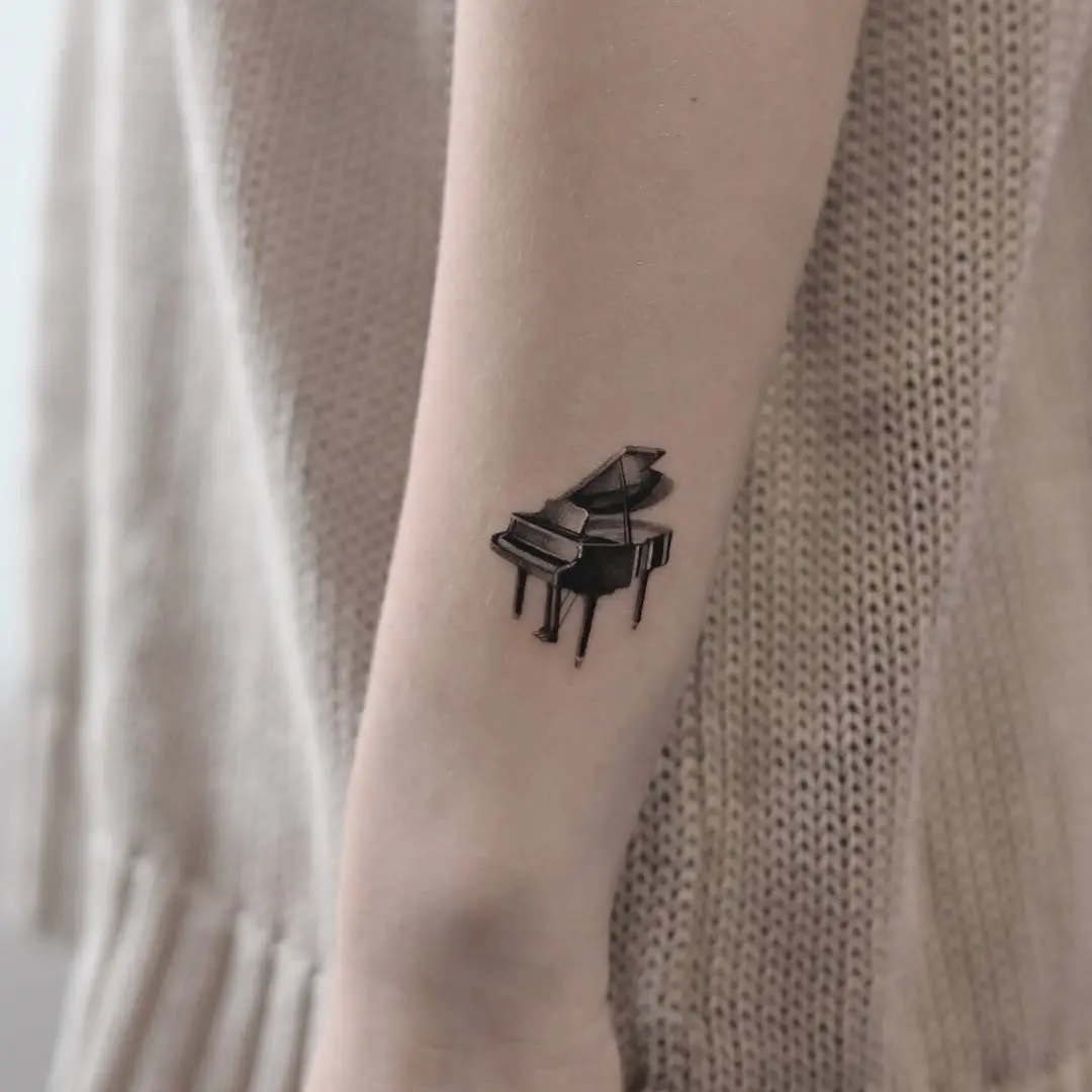 Stylish Minimalist Piano Tattoo on Forearm