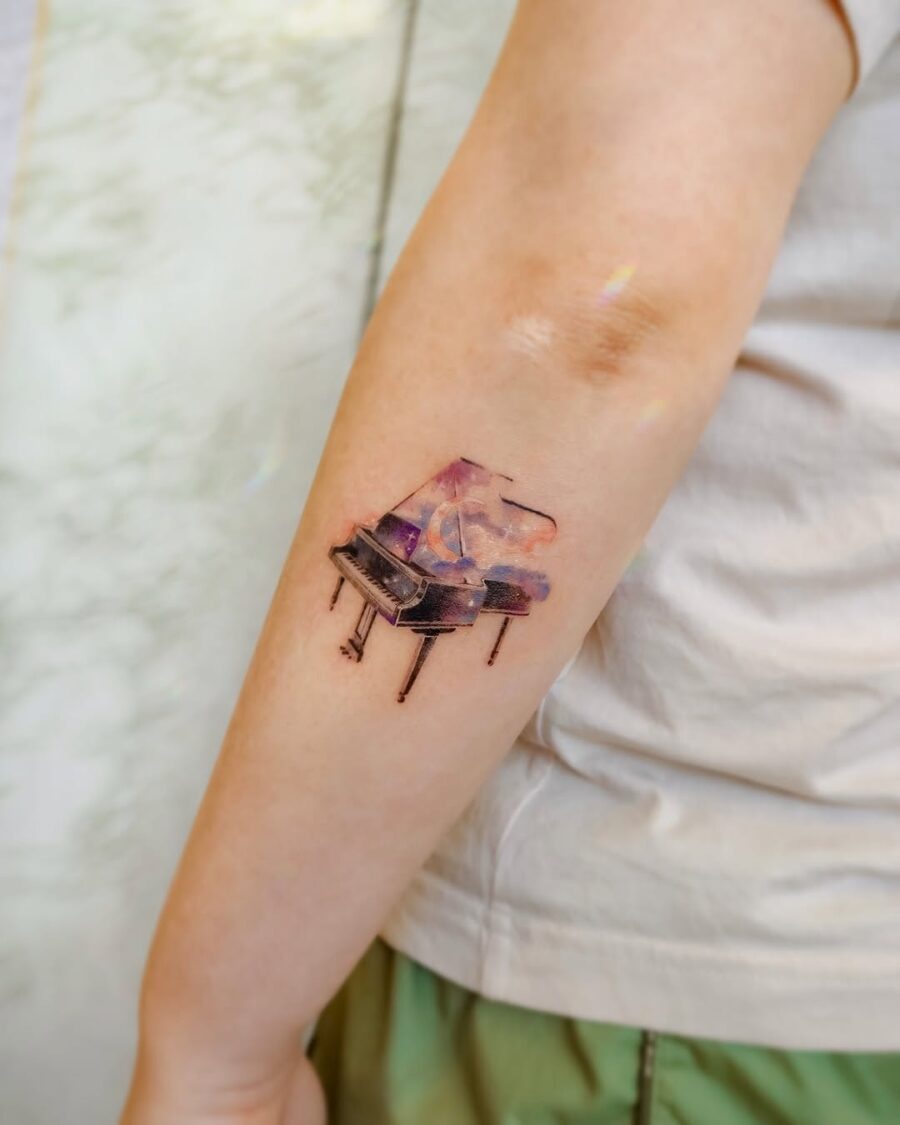 A vibrant grand piano tattoo exuding creativity
