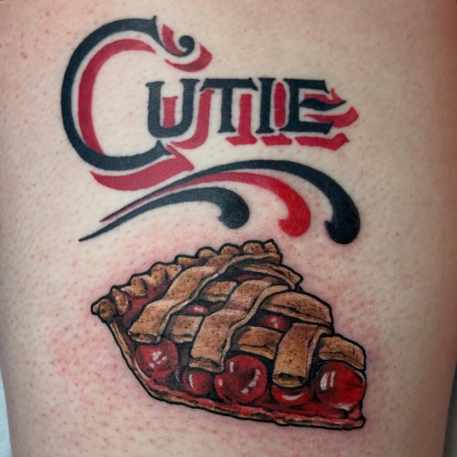 Playful pie tattoo with vibrant lettering