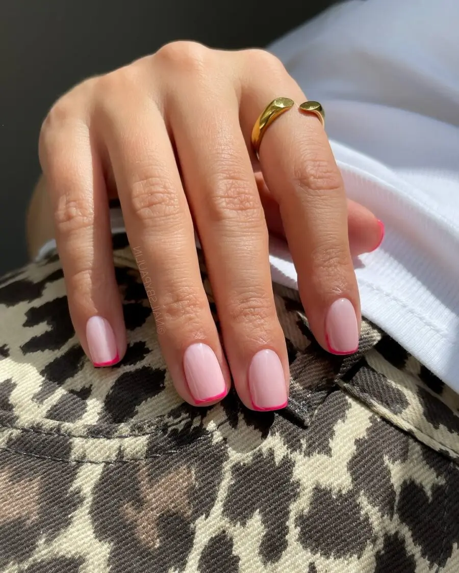 Chic pink French tips on stylish nails