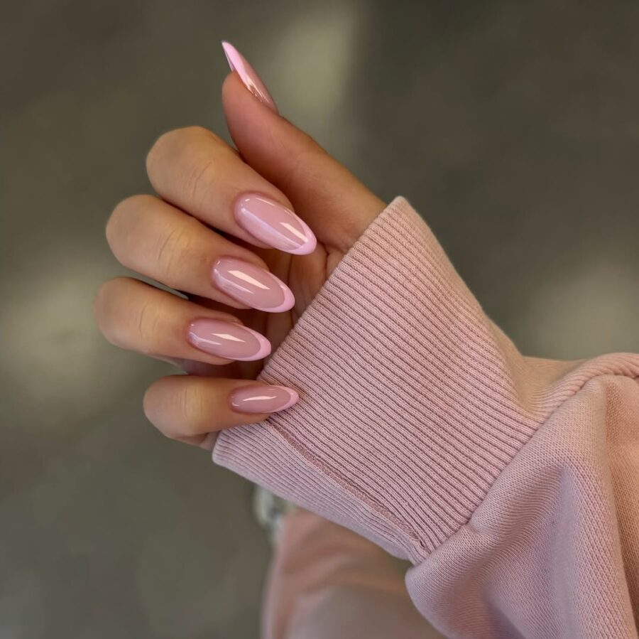 Stylish pink French tip nails in chic design