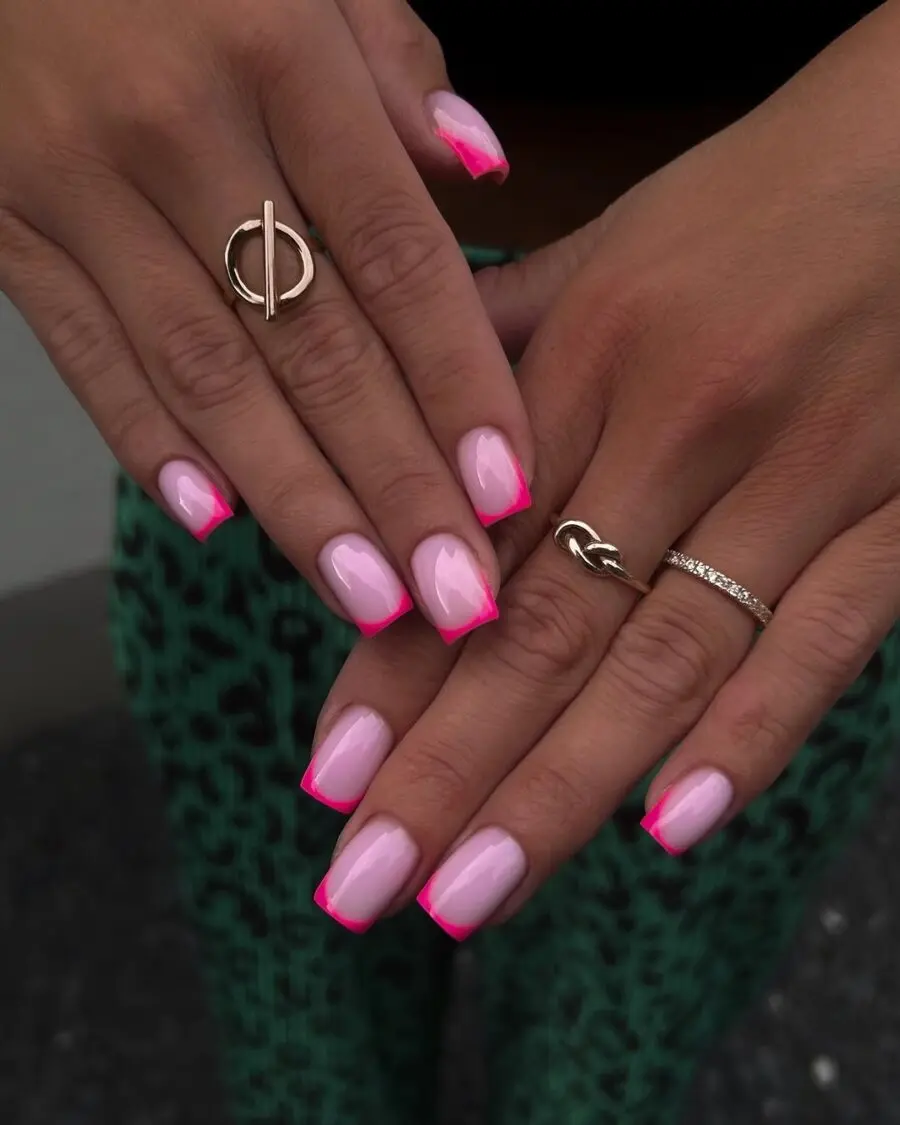 Chic pink french tips with stylish rings