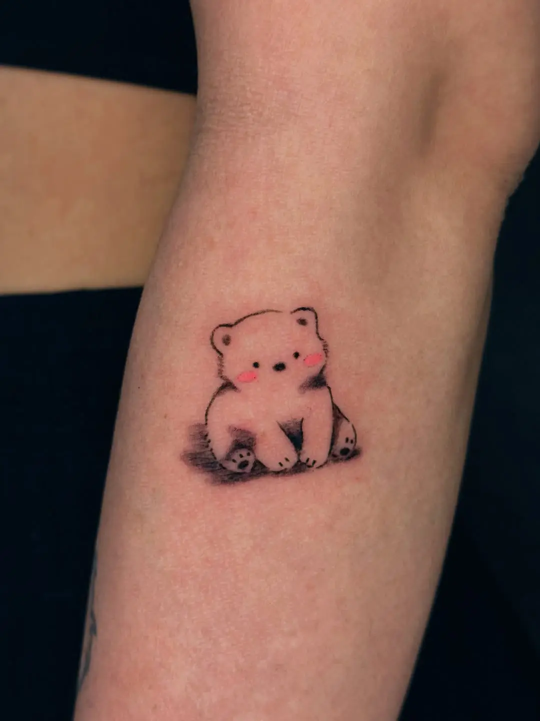 Adorable polar bear tattoo with a playful vibe
