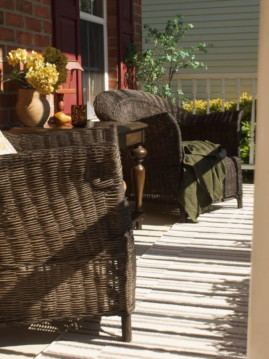 Cozy rattan chairs with a charming table setup