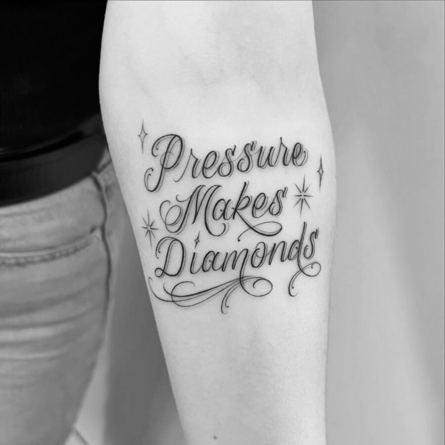 Elegant script tattoo with inspiring message