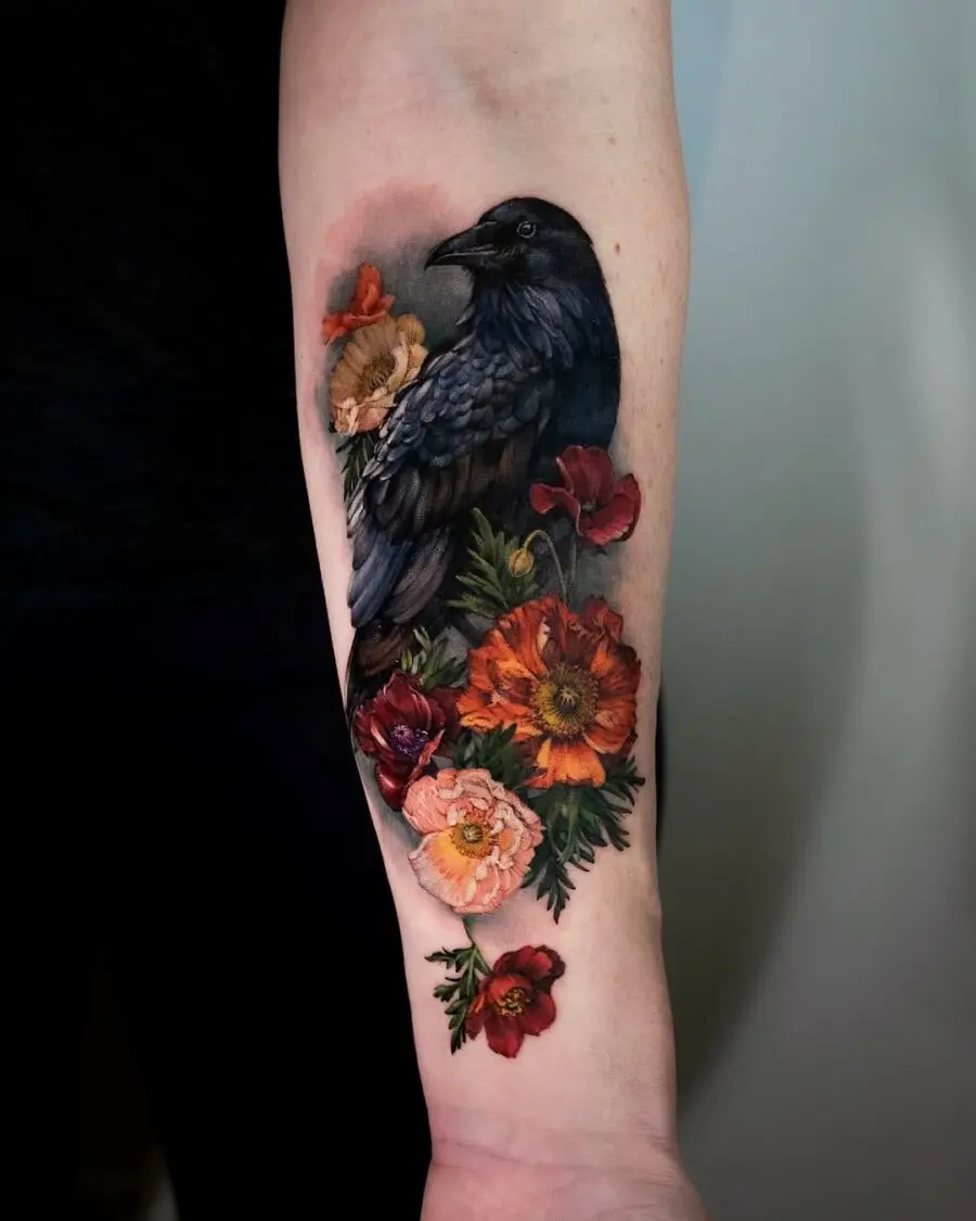 Intricate Raven Tattoo Surrounded by Colorful Blooms