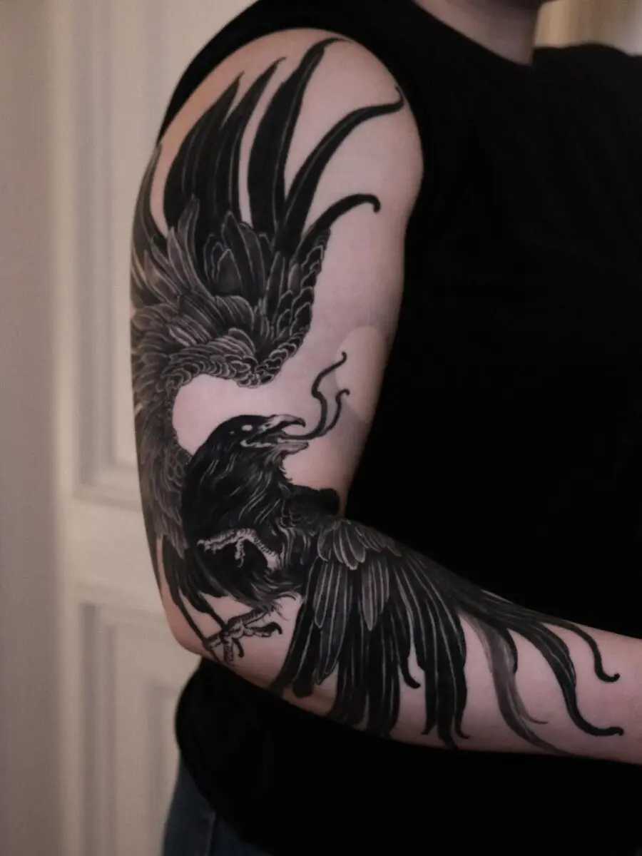 Bold raven tattoo with intricate detailing