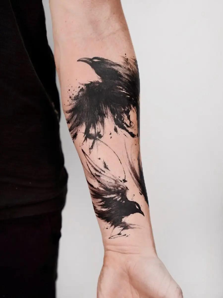Stunning artistic raven tattoo with dynamic splashes
