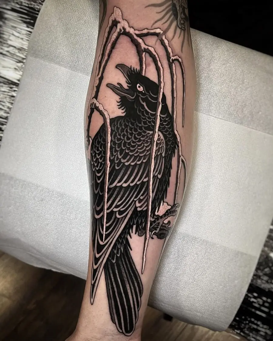 Intricate raven tattoo with stylized elements