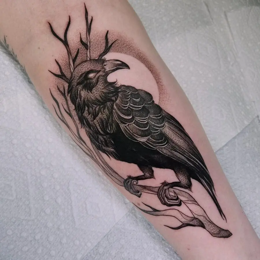 Intricate raven tattoo with nature elements