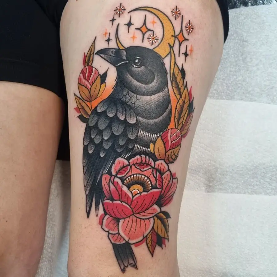 Bold raven tattoo with floral elements