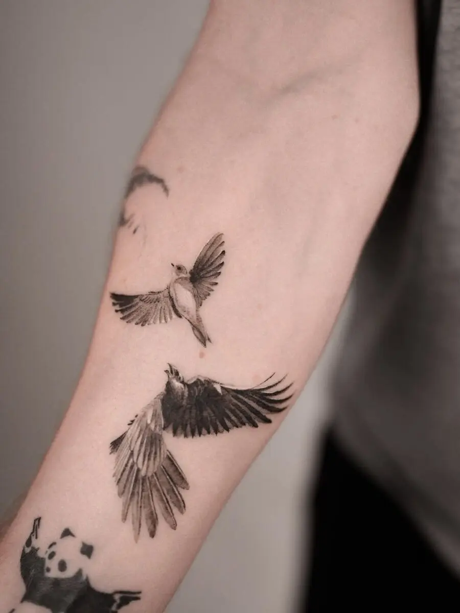 Elegant raven tattoos embody freedom and mystery