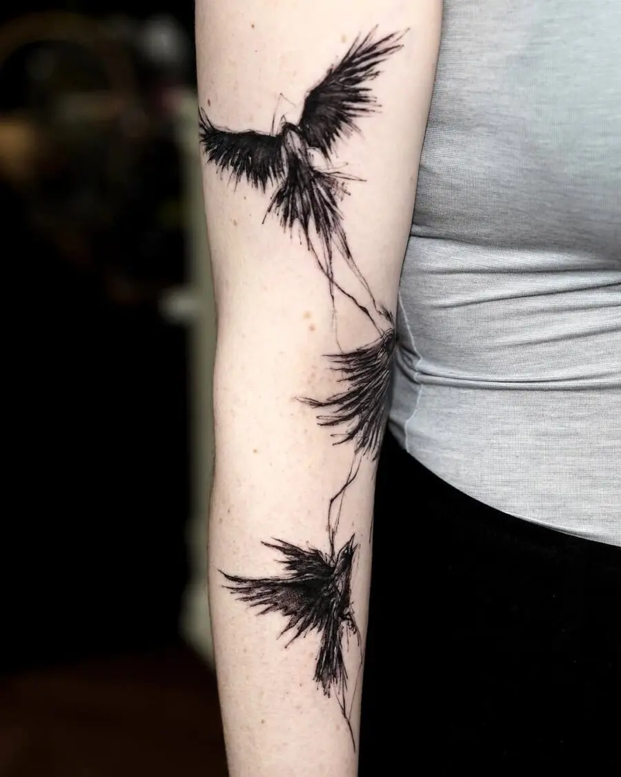 Elegant flying ravens in stunning black ink