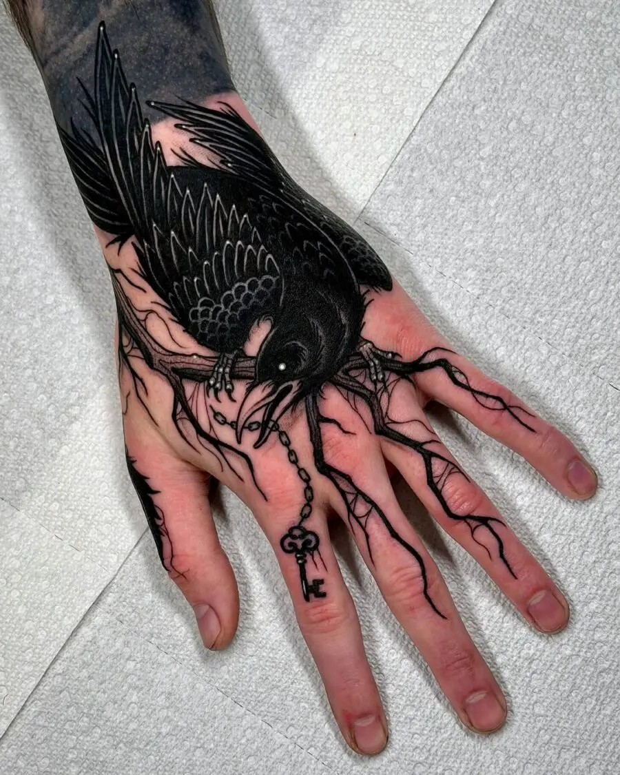 Intricate raven tattoo with key symbolism