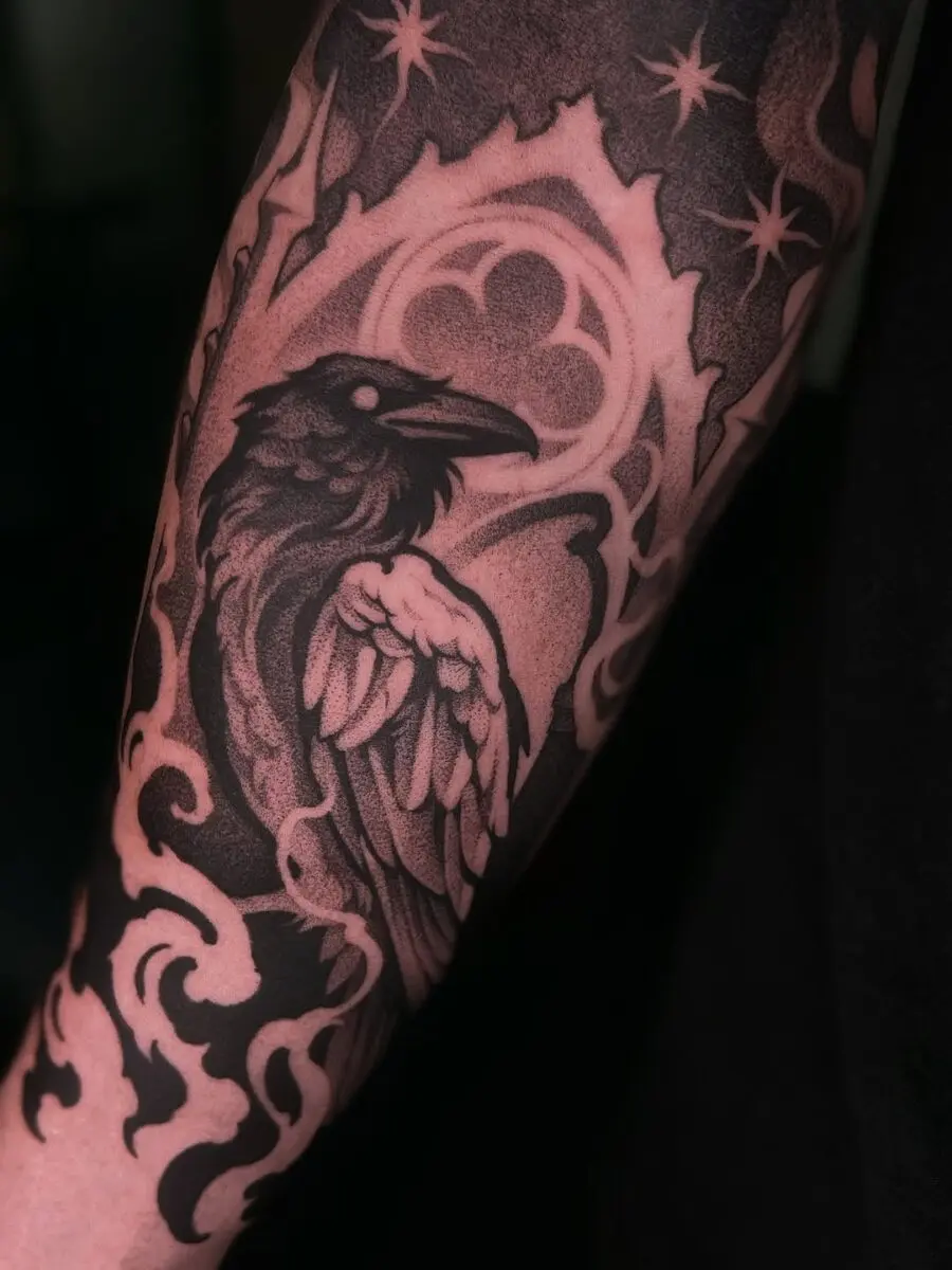 Intricate raven tattoo with bold black elements