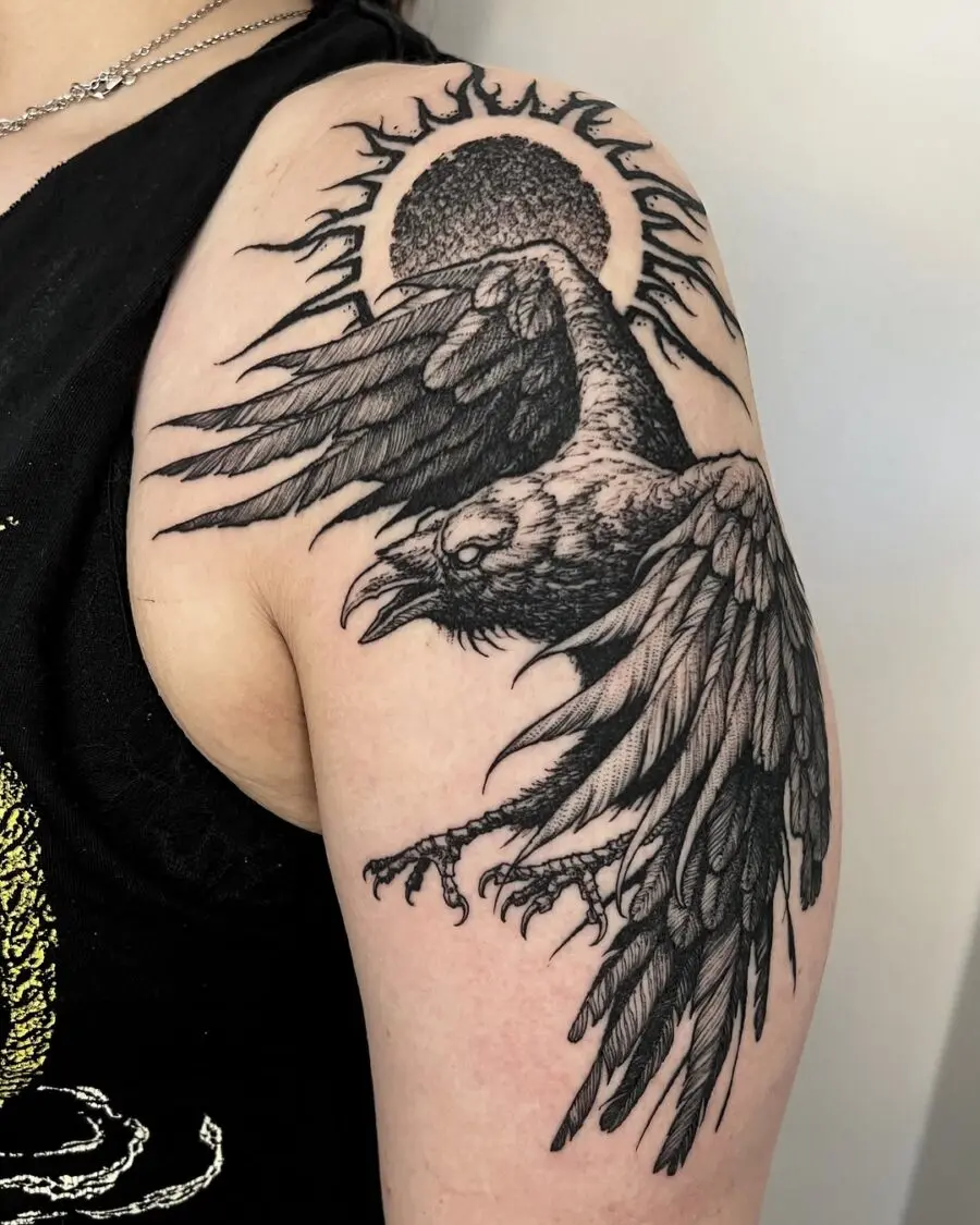 Intricate raven tattoo with sun silhouette