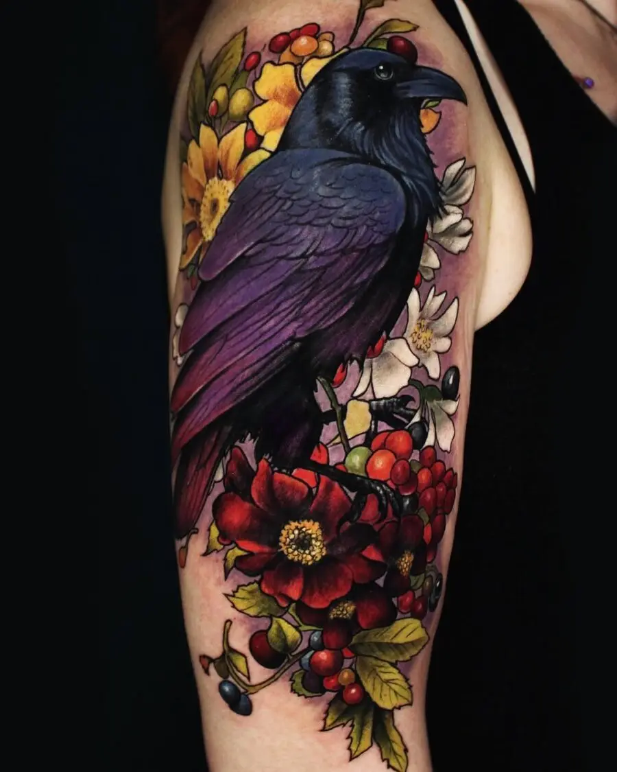Stunning raven tattoo with floral elements
