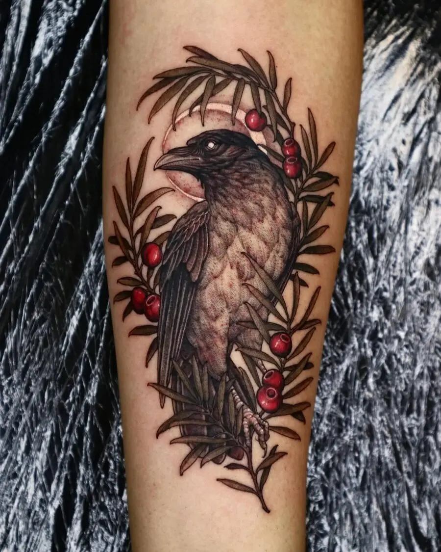 Elegant raven tattoo adorned with berries