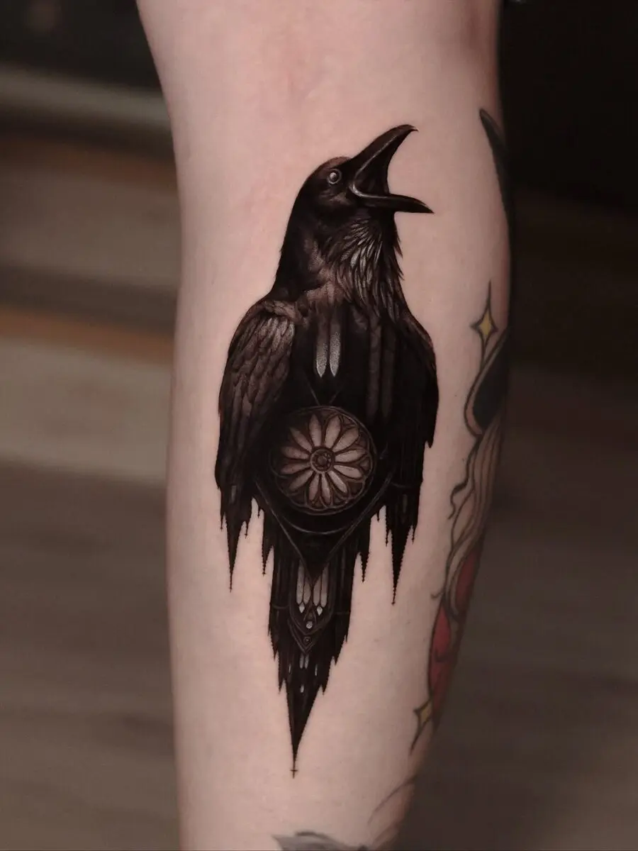 Intricately designed raven tattoo with floral elements
