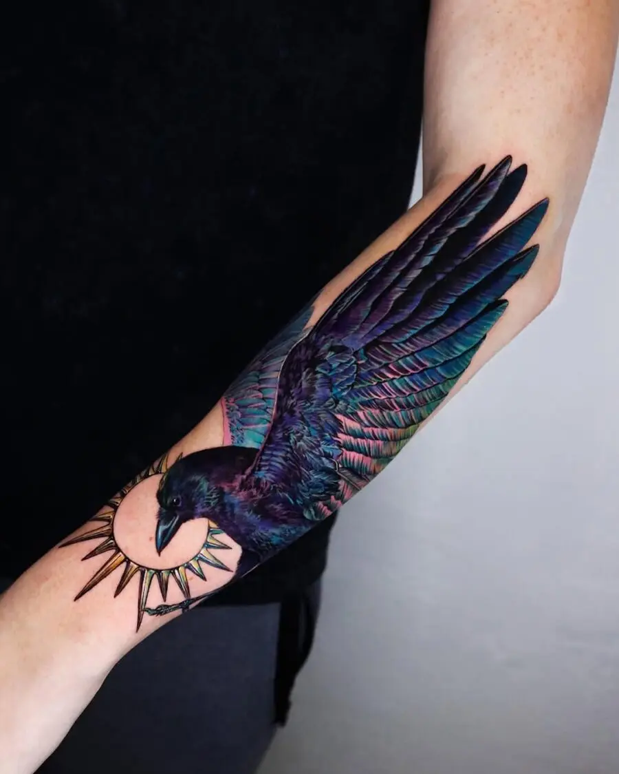 Colorful Raven Tattoo with Radiant Sun Design