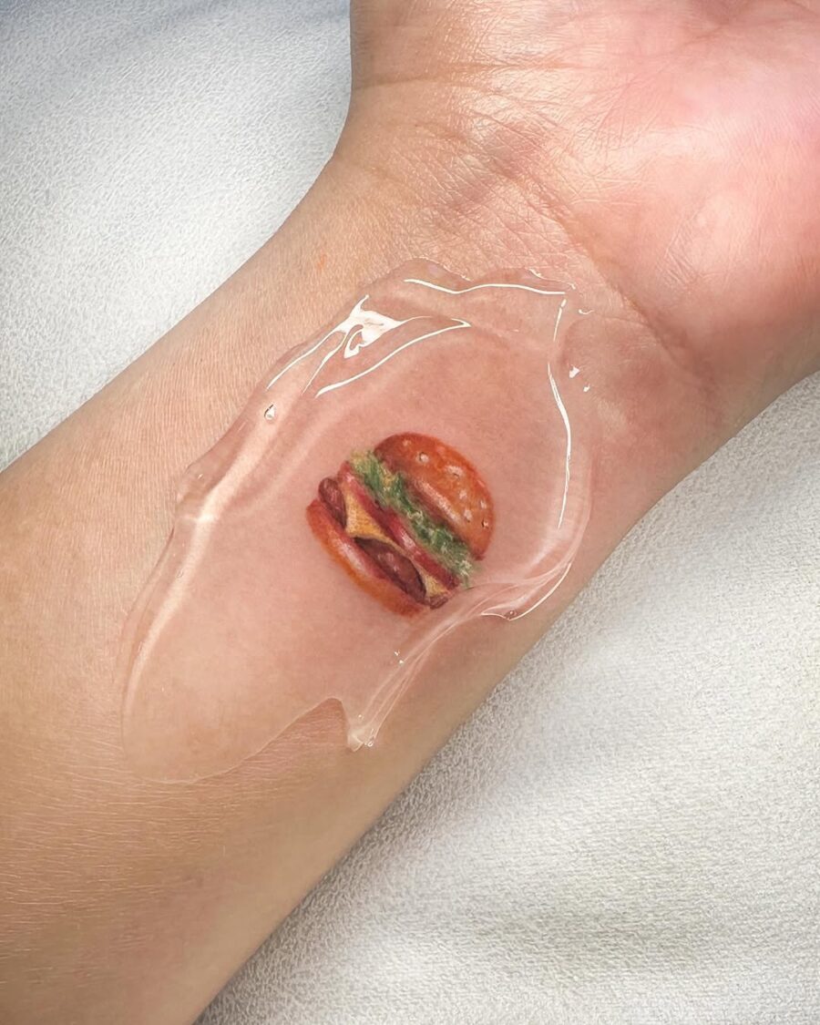 A realistic burger tattoo with glossy details