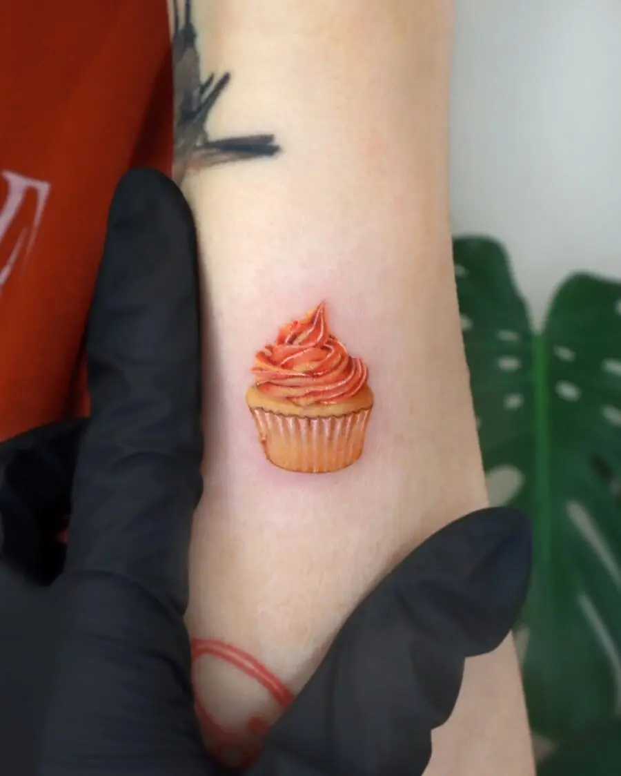 Whimsical cupcake tattoo perfect for dessert lovers