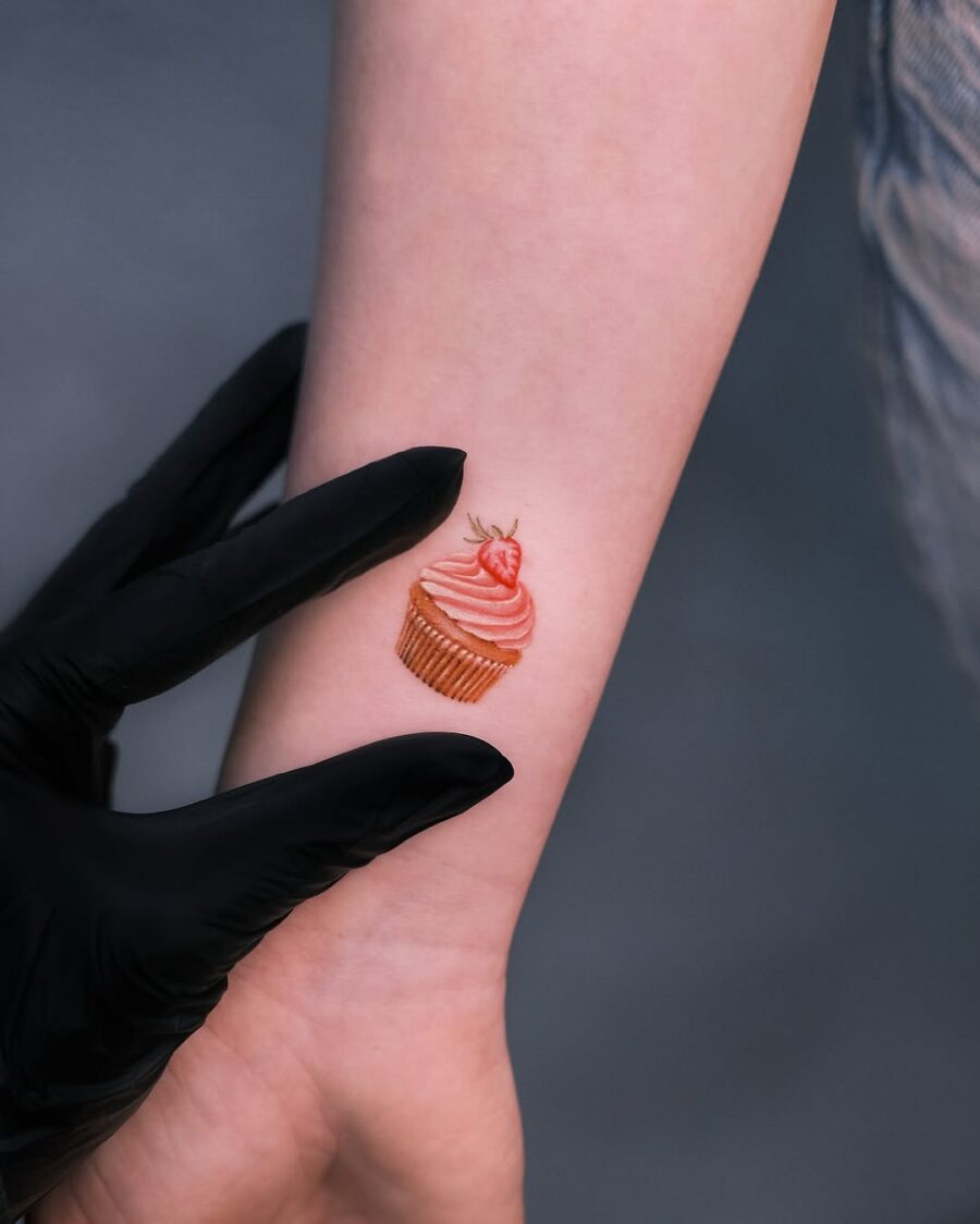 Charming cupcake tattoo on a delicate wrist