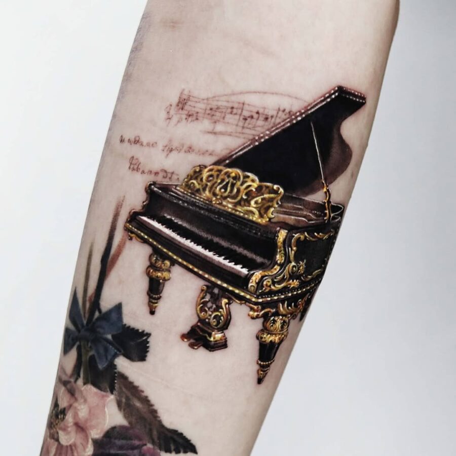Stunning Detailed Piano Tattoo on Forearm