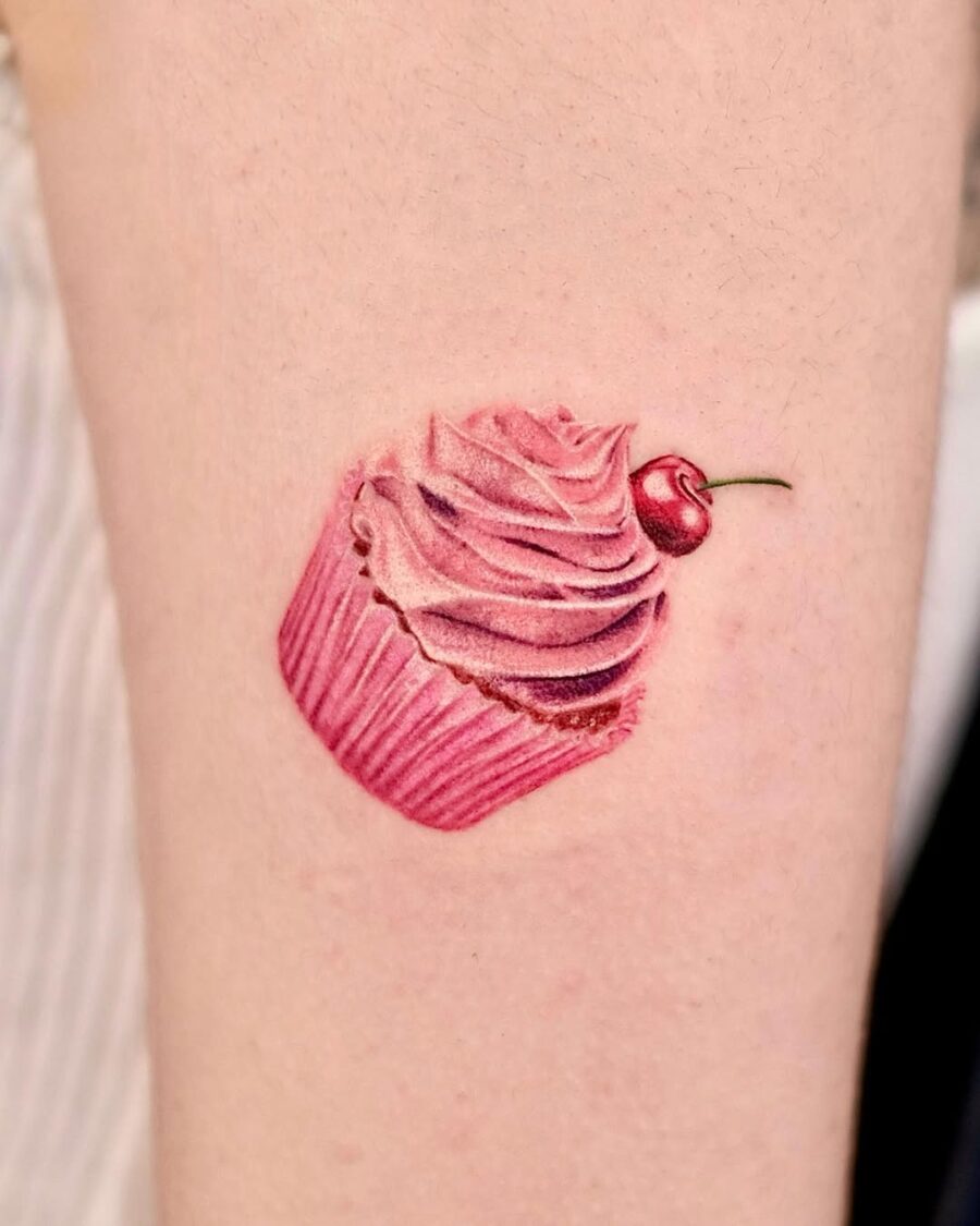Deliciously vibrant pink cupcake tattoo design