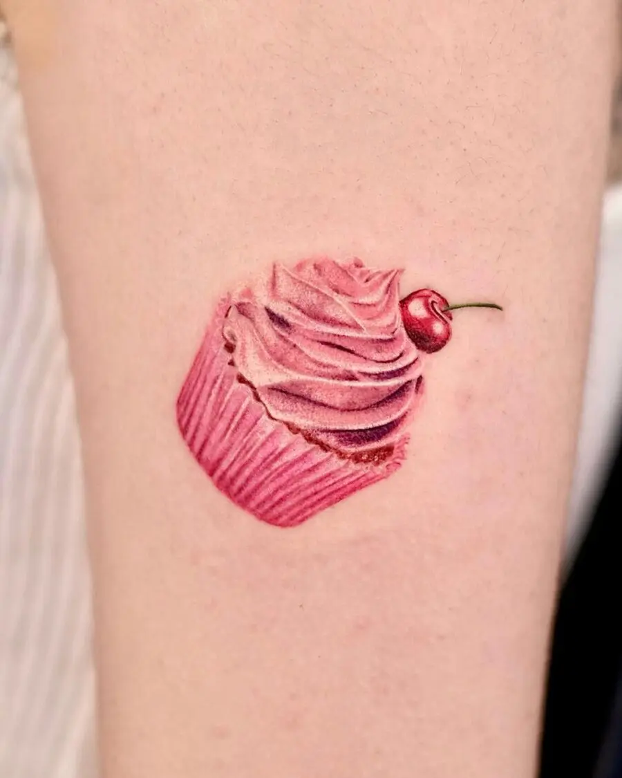 Deliciously vibrant pink cupcake tattoo design