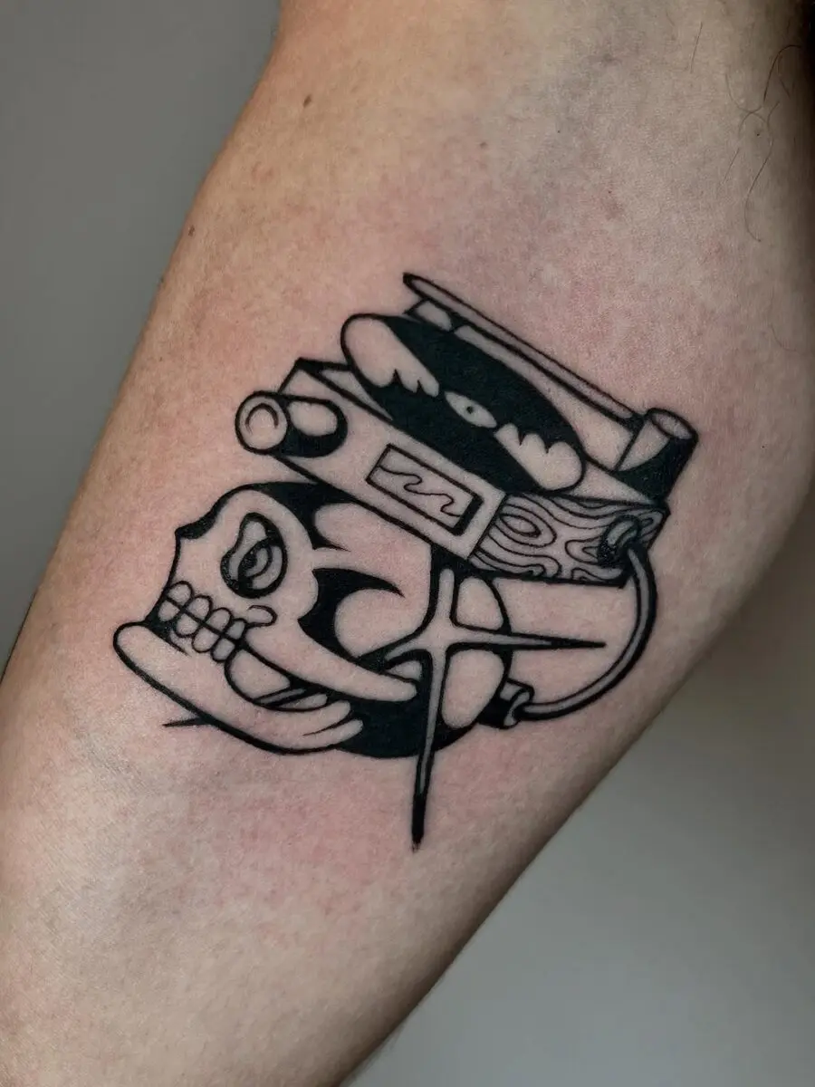 Stylish skull with record player tattoo design