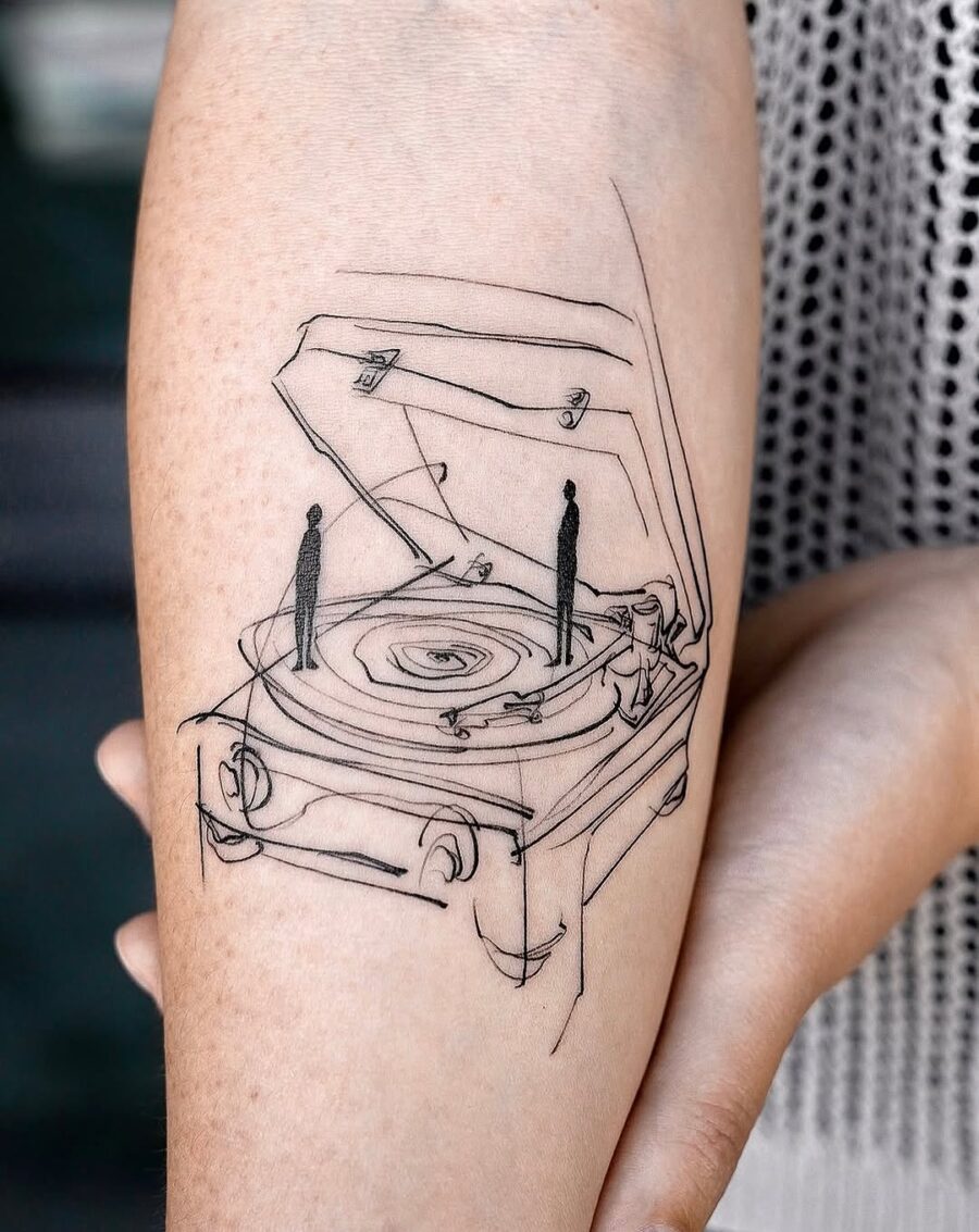 Minimalist record player tattoo with silhouettes