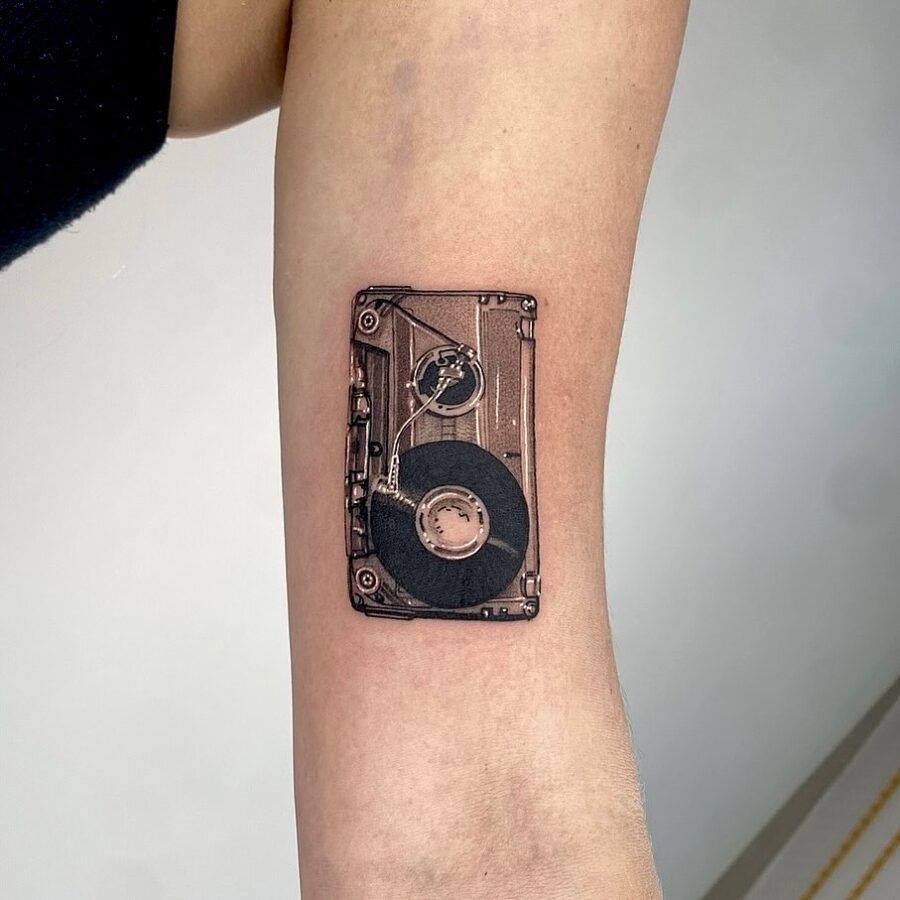 Vintage record player tattoo for music lovers