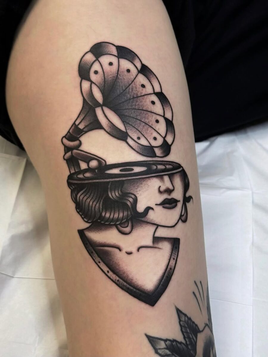 Elegant vintage tattoo of a gramophone lady