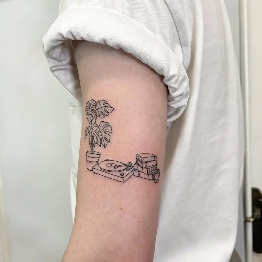 Charming minimalism in record player tattoo