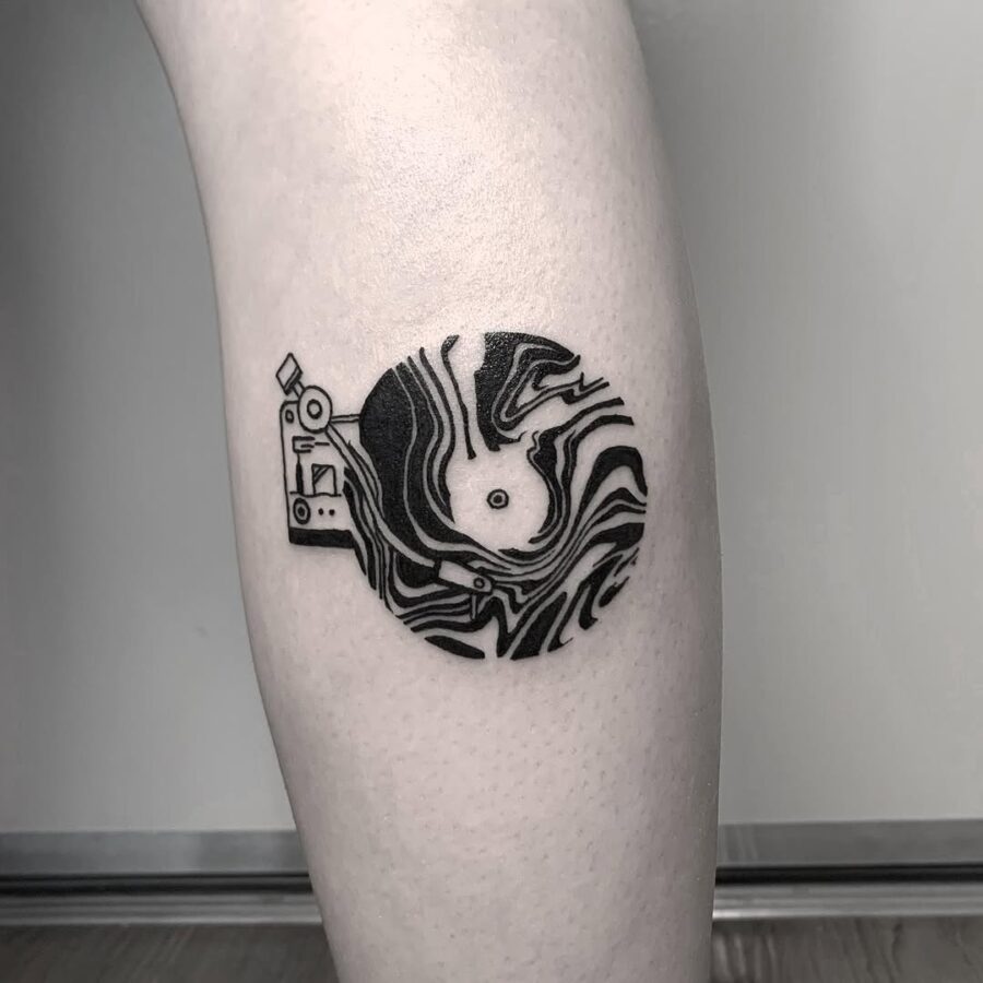 Stylish record player tattoo with abstract vibes