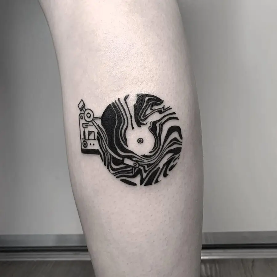 Stylish record player tattoo with abstract vibes