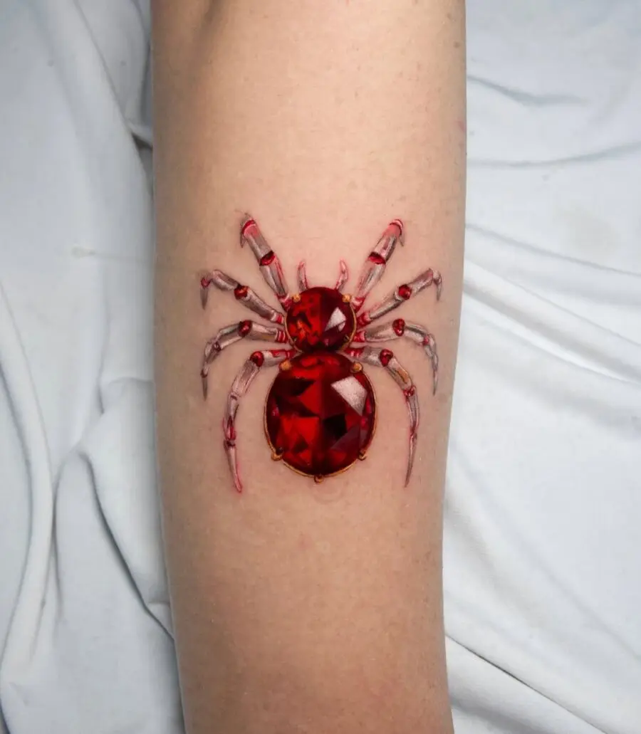 Vibrant red gemstone spider tattoo design