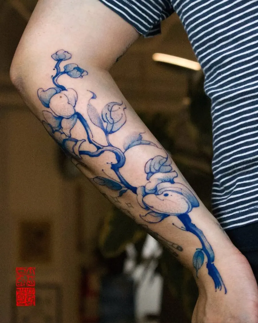 Elegant sampaguita tattoo design with blue hues.