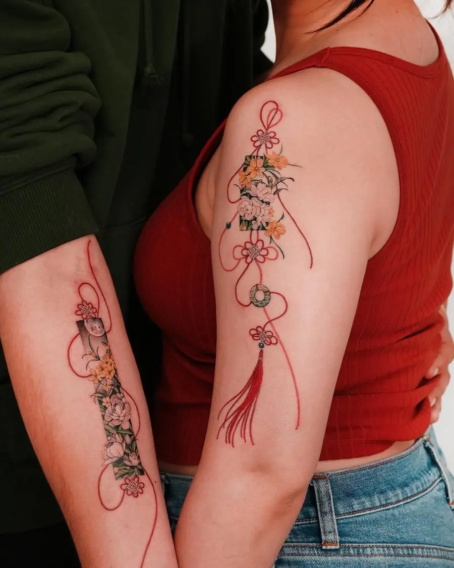 Beautiful couple tattoos featuring delicate floral designs