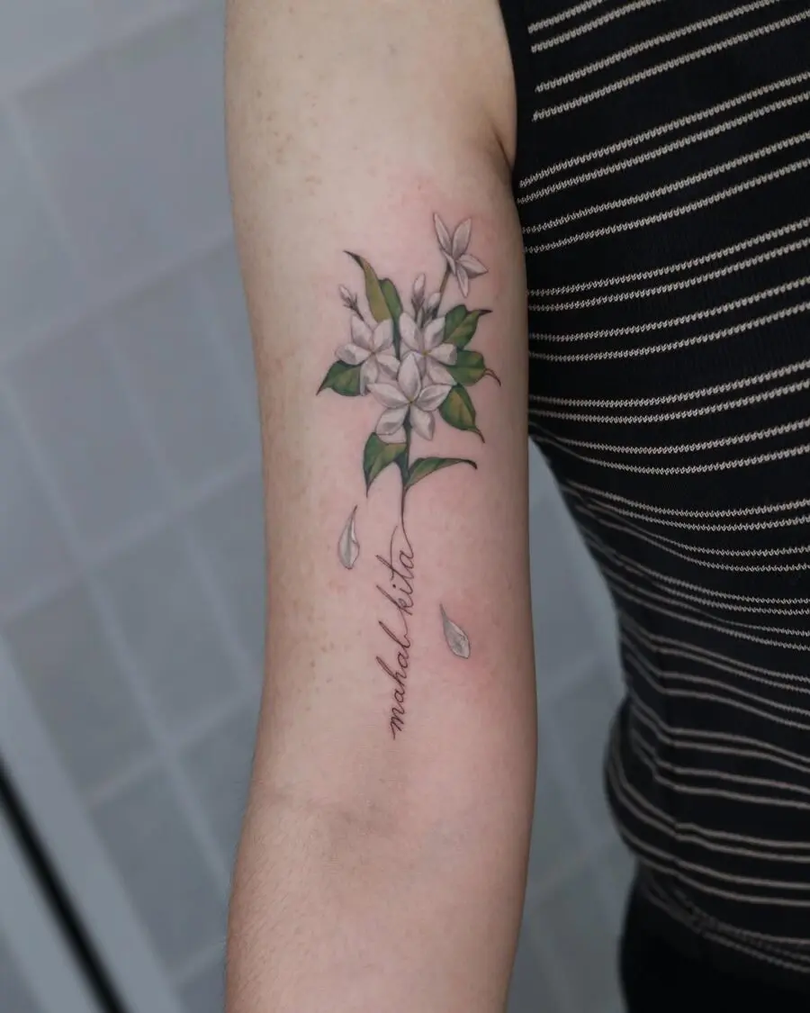 Delicate sampaguita floral tattoo design on arm