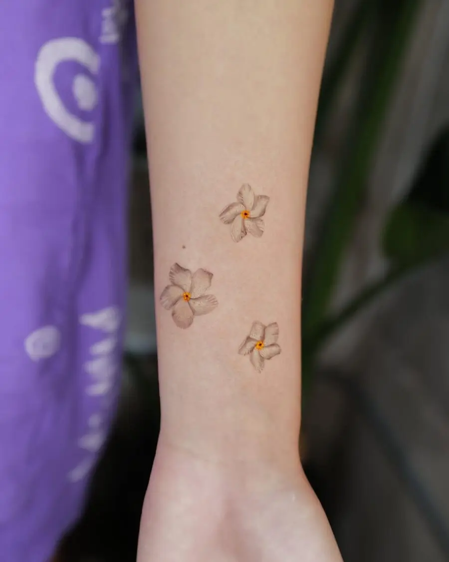 Three Elegant Sampaguita Tattoos on Forearm