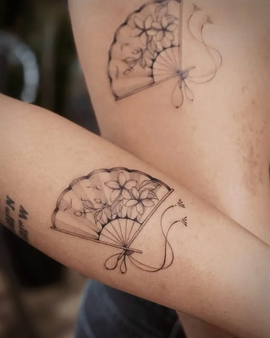 Elegant sampaguita fan tattoo with floral motifs