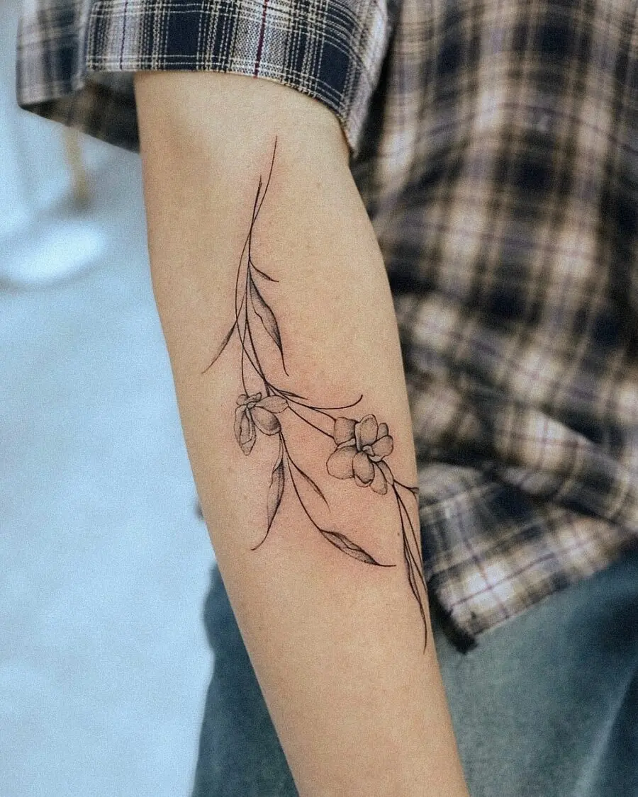 Elegant sampaguita tattoo with delicate floral details