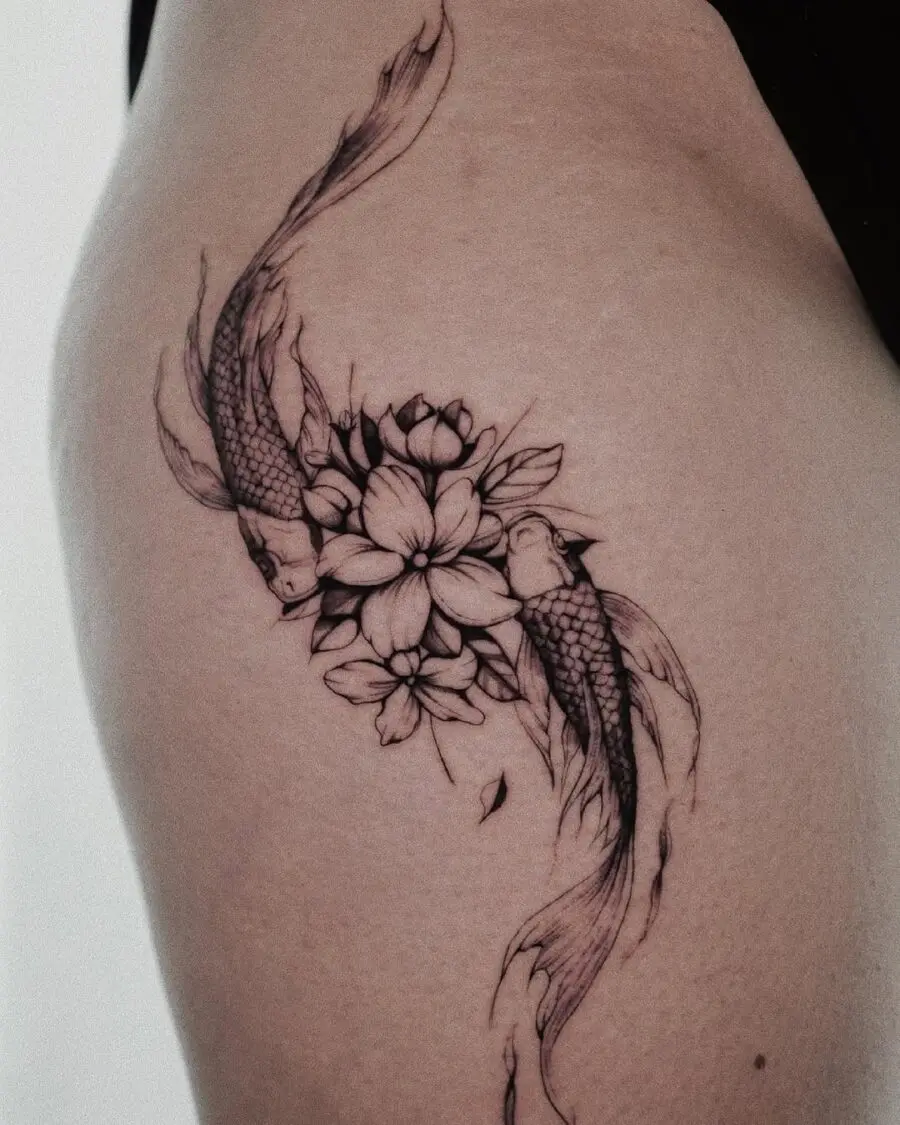 Elegant sampaguita tattoo with koi fish detail