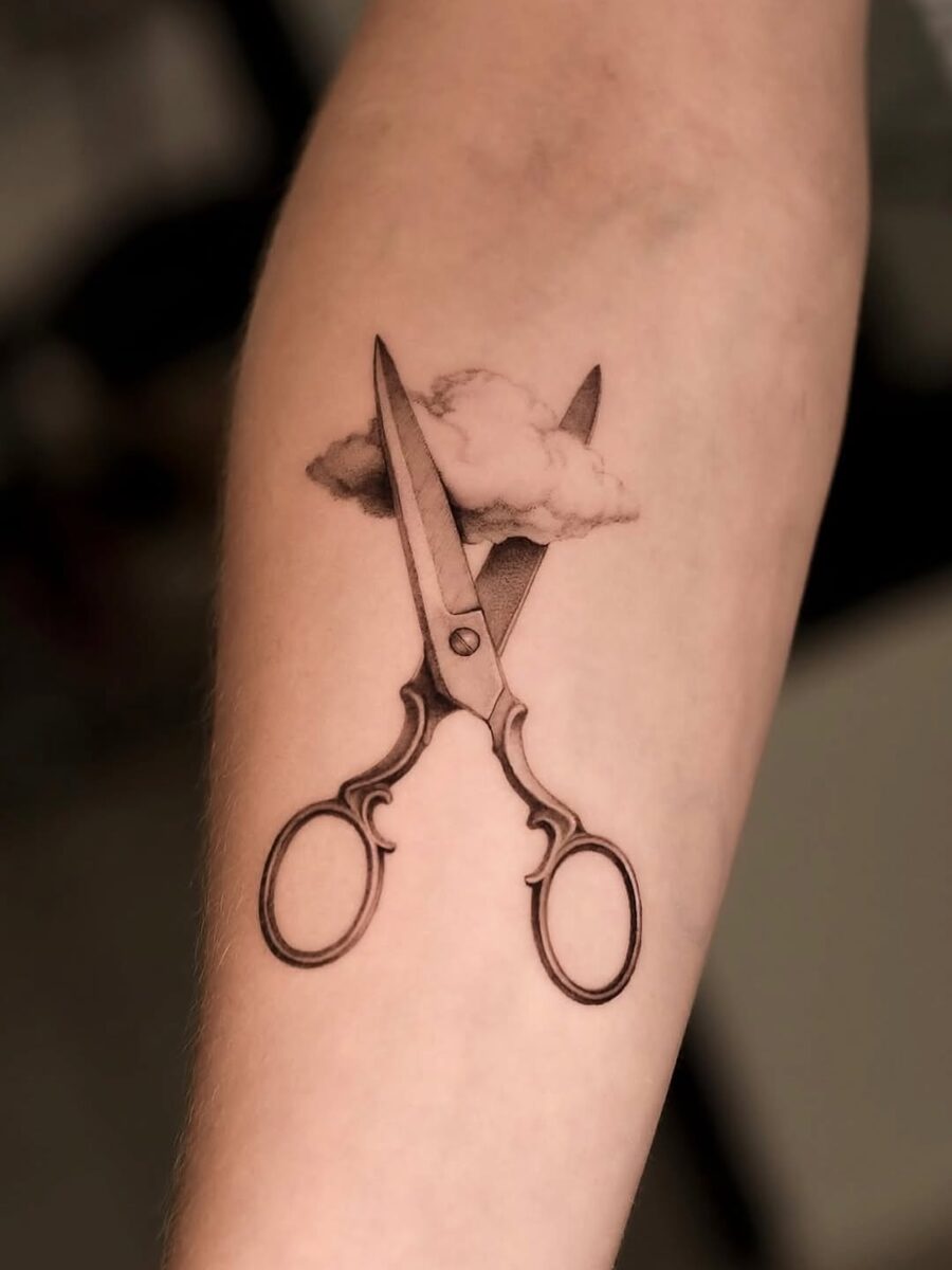 Aesthetic scissors tattoo with cloud detail